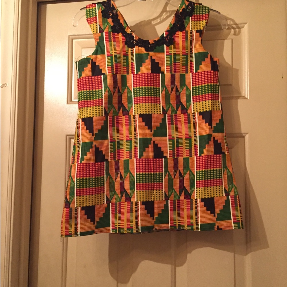 Child’s kente cloth dress and crop top.